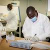 Global Health Security Capabilities - Mozambique ECHO HIV technicians in laboratory running HIV tests
